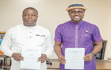 Dr Bright Adom (left), Chief Executive Officer of Adom Group of Companies, with Gilbert Abeiku Aggrey, aka Abeiku Santana